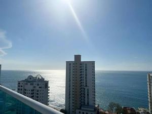 a view of the ocean from the balcony of a building at Apartamento exclusivo en Santa Marta cerca al mar in Gaira