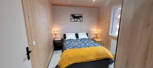 Postel nebo postele na pokoji v ubytování gîte du haras