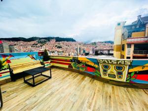 a bench on top of a building with a view of a city at Las Brisas in La Paz