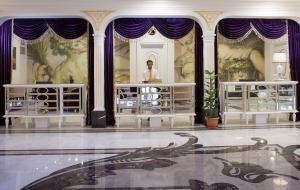 a man standing behind a table in a room at Orange Palace Side - All Inclusive in Side +25 photos