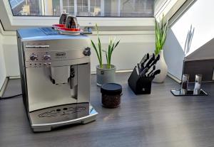 a coffee machine sitting on top of a table at Ferienwohnung 360° in Himmelkron