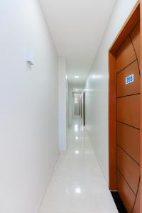a hallway of a building with a sign on it at Pousada Meireles in Fortaleza
