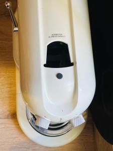 a white mixer with a hat on top of it at Le Mathilde Cocoon in the heart of Les Halles in Tours