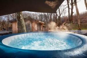 a hot tub with steam coming out of it at Pikol Lake Village Wine Estate in Nova Gorica
