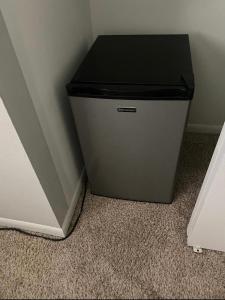 a trash can sitting in the corner of a room at Sweet dreams private room across from the Hard Rock Casino in Tampa