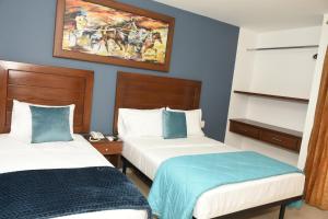 Postel nebo postele na pokoji v ubytování Hotel Kai Soledad Atlántico