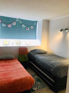 Кровать или кровати в номере Departamento en Playa Coquimbo La Serena