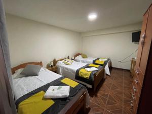 Postel nebo postele na pokoji v ubytování Hostal CECIL +