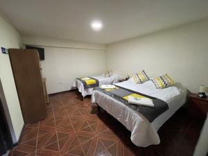 Postel nebo postele na pokoji v ubytování Hostal CECIL +