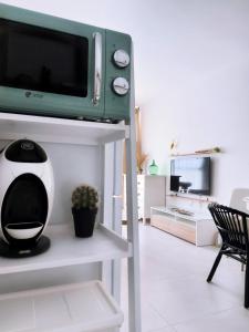 Televízia a/alebo spoločenská miestnosť v ubytovaní CASA CARBÓN