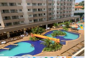 an aerial view of a resort with two pools at Enjoy Olímpia Park Resort in Olímpia