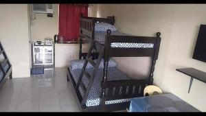 A bed or beds in a room at RV3 TRANSIENT HOUSE