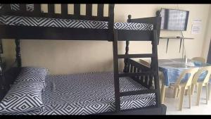 A bed or beds in a room at RV3 TRANSIENT HOUSE