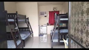 A bed or beds in a room at RV3 TRANSIENT HOUSE
