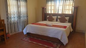 Vuode tai vuoteita majoituspaikassa London House Resort