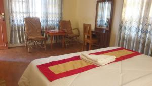 Vuode tai vuoteita majoituspaikassa London House Resort