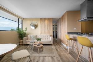 a living room with a couch and a table at Apartamentos Go Living & Suites by HOUSY HOST in Medellín