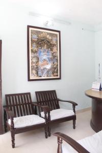 Un lugar para sentarse en Pushpa Guest House