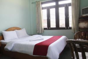 Una cama o camas en una habitación de Pushpa Guest House