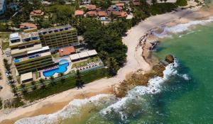 an aerial view of a resort on a beach at Life Tabatinga Beach-Flat com Wi-Fi in Conde