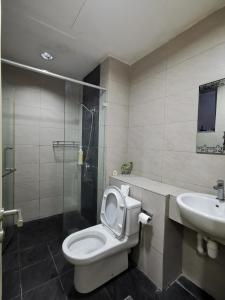 a bathroom with a toilet and a sink and a shower at BC The Loft 3A Imago Studio in Kota Kinabalu