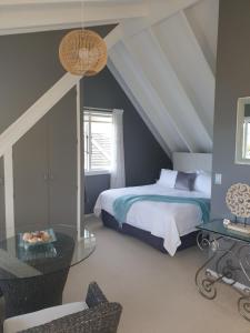 Ένα ή περισσότερα κρεβάτια σε δωμάτιο στο Brenton Lodge