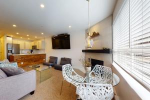 a living room with a couch and a table at Market Place Lodge 249 in Whistler