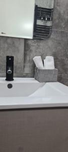 a bathroom sink with two towels on top of it at Cozy Apartment by the sea in Limassol