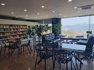 a store with chairs and tables in a room at Sancheong Korean Medicine Family Hotel in Sancheong