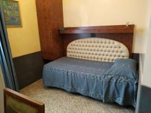A bed or beds in a room at Atlantide Hotel