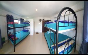 Letto o letti in una camera di P & T Hostel