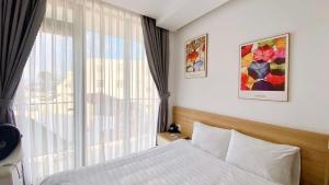 Voodi või voodid majutusasutuse L'amie Hotel & Studio toas