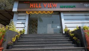 a building with stairs in front of a hospital at VIJAYA HILL VIEW RESIDENCY in Navi Mumbai