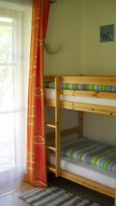 a bunk bed in a room with a window at Kalßnhof in Bad Aussee
