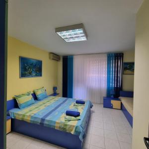 Postel nebo postele na pokoji v ubytování GALA APARTMENT
