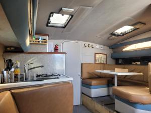 a kitchen with a sink and a stove in a trailer at Beamar in Valencia