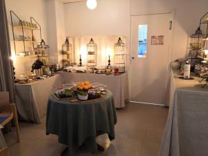 a room with a table with a bowl of fruit on it at Hotel Kuusanka in Kuusamo