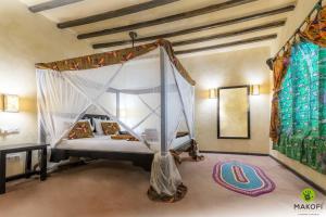 Postel nebo postele na pokoji v ubytování Makofi Guest House