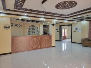 a lobby with a reception desk in a building at MELODIA Guest House in Bukhara +48 photos