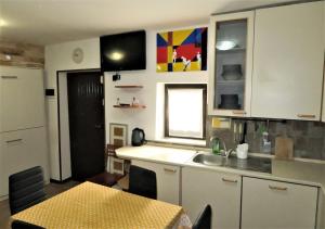 Кухня или мини-кухня в Appartamento Savona
