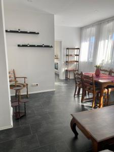 a dining room with a table and chairs at Pension Kaufungen in Kaufungen