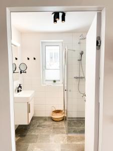 a bathroom with a shower and a sink at PAM Apartments in Kaprun