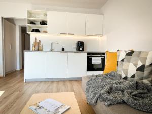 Kuchyň nebo kuchyňský kout v ubytování PAM Apartments