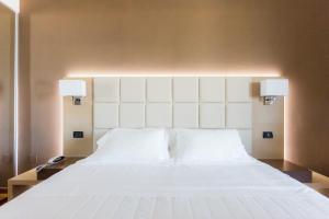 Postel nebo postele na pokoji v ubytování Raffaello Hotel & Mooka Restaurant
