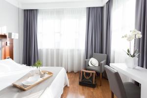 Postel nebo postele na pokoji v ubytování Raffaello Hotel & Mooka Restaurant