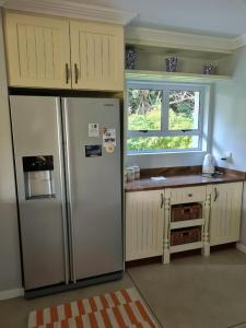 A kitchen or kitchenette at Caribbeans Estates 76/34