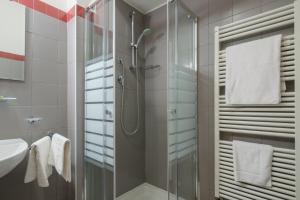 a bathroom with a shower and a sink at Residenza Ariosto by Studio Vita in Bologna +158 photos