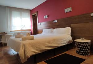 Posteľ alebo postele v izbe v ubytovaní Hotel Cuéntame
