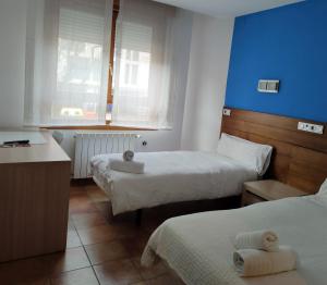 Posteľ alebo postele v izbe v ubytovaní Hotel Cuéntame