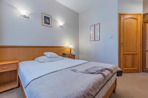 Posteľ alebo postele v izbe v ubytovaní Hotel Nosalowy Dwór